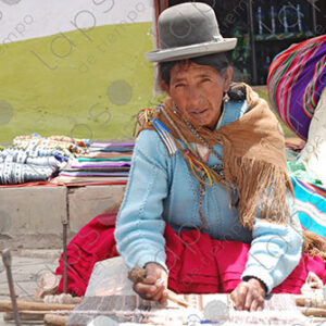 Bolivian lady weaving on her loom