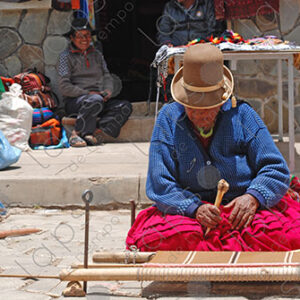 Bolivian lady weaving on her loom