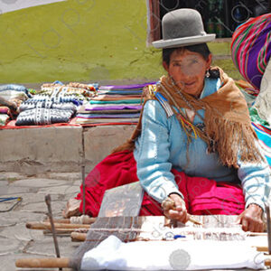 Bolivian lady weaving on her loom