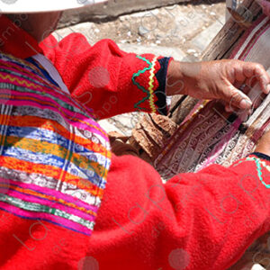 Detail of a woman weaving on a loom