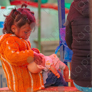Girl playing with a doll