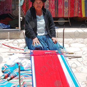 Woman shows her loom