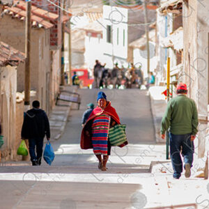 Indigenous woman walking with shopping bags