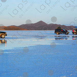 Landscape of Salar de Uyuni with Trucks and People