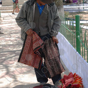 Man shows ancestral woven fabrics