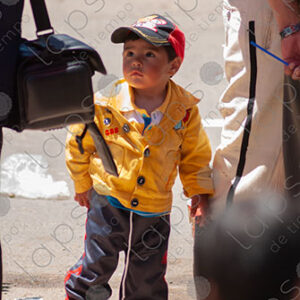 Boy wears yellow jacket
