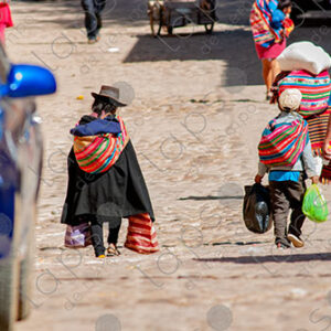 Young child, carrying bags