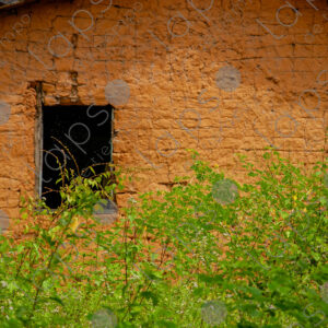 Adobe wall with a small window