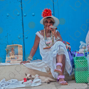 Cuban woman portrait with cats and a cigar