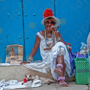 Cuban woman portrait with cats and a cigar