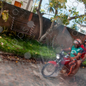 view from moving car, motorcyclists