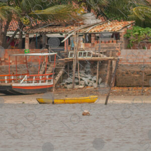 House and barges on the river