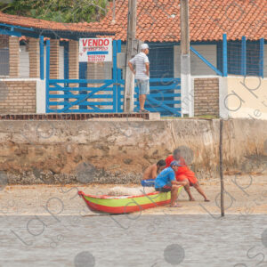 House and barges on the riverbank