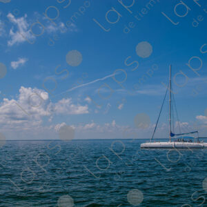Landscape with yacht against a backdrop of a blue sea horizon