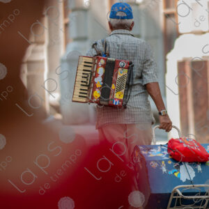 Man carrying an accordion