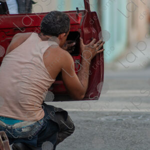 Man repairing a car door