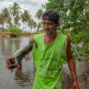 Man showing a crab