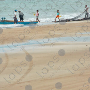 Men with boats and nets on the seashore