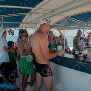 Party on a yacht, with crew and tourists