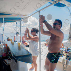 Party on a yacht, with crew and tourists