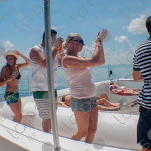 Party on a yacht, with crew and tourists
