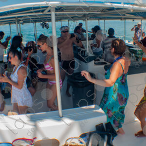 Party on a yacht, with crew and tourists