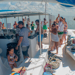 Party on a yacht, with crew and tourists