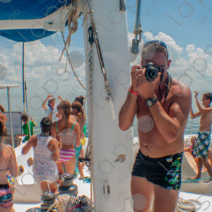 Party on a yacht, with crew and tourists