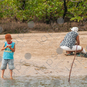 Redhaired boy by the riverside