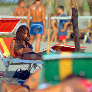 Torvaianica woman on beach lounger, Italy
