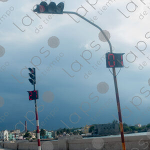 Traffic lights with gray clouds