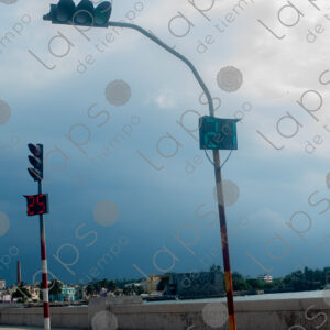 Traffic lights with gray clouds