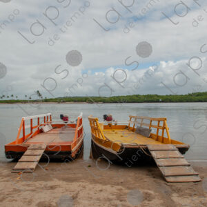 Two barges on the riverbank