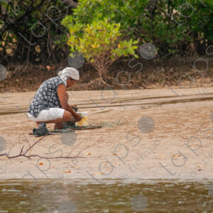 Woman working with river cages