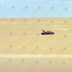 Peugeot 404 in the middle of the desert, cooling down