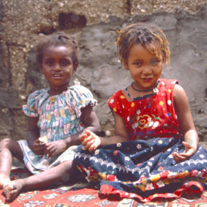 Two Girls Sitting on the Ground
