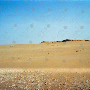 Western Sahara Desert, cars and people in the distance