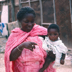 Woman Dressed in Islamic Clothing with Baby in Her Arms